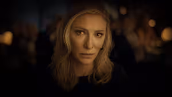 Catherine Ravenscroft (Cate Blanchett) looks ahead in a dimly lit room