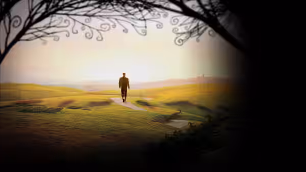 Ed Bloom walks along a winding path through rolling green hills at dawn