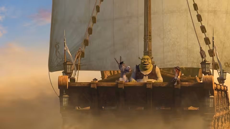 Shrek, Donkey, and Puss in Boots stand aboard a sailing ship