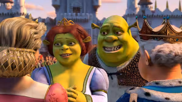 Fiona and Shrek greet the crowned King Harold and Queen Lillian before the castle