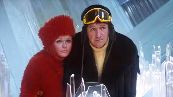 Eve Teschmacher (Valerie Perrine) and Lex Luthor (Gene Hackman) peer between crystals in the Fortress of Solitude