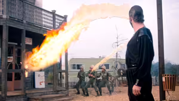 General Zod (Terence Stamp) directs a blast of fire toward soldiers on a town street
