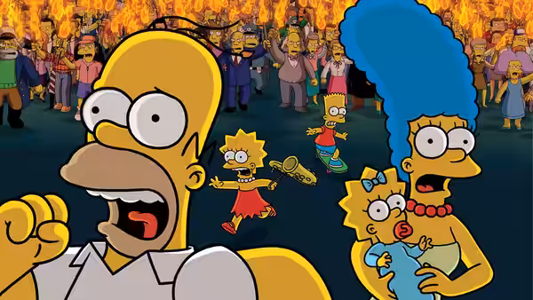 Homer Simpson (Dan Castellaneta) reacts before a cheering crowd as Marge holds Maggie nearby