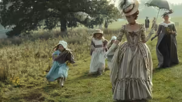 Georgiana Cavendish (Keira Knightley) walks through a meadow with children and attendants