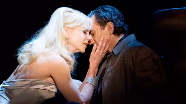 Claudia (Nicole Kidman) touches Guido Contini’s face as they lean close together