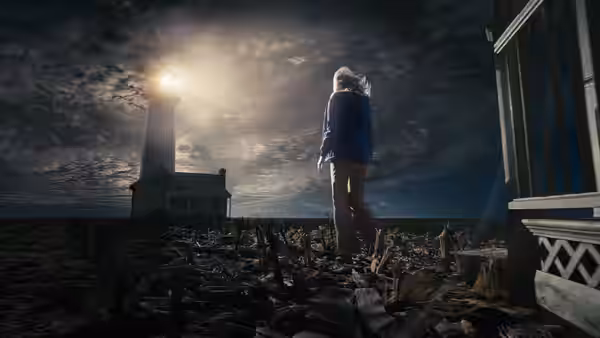A girl in a blue coat stands among dark branches beneath a glowing lighthouse