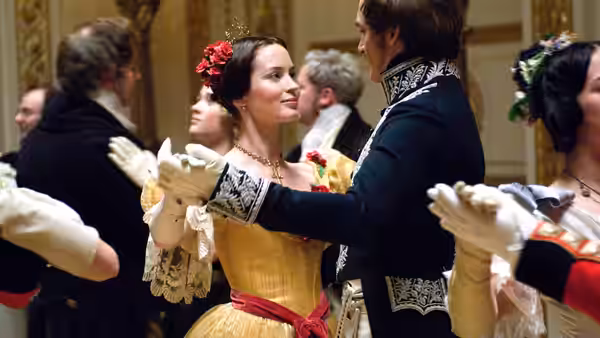 Queen Victoria (Emily Blunt) dances with Prince Albert (Rupert Friend) at a palace ball