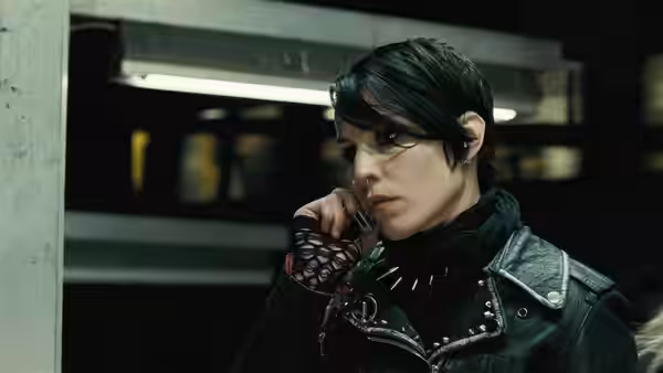 Lisbeth Salander (Noomi Rapace) speaks on a mobile phone in a leather jacket