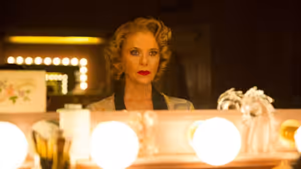 Gloria Grahame (Annette Bening) looks into a brightly lit dressing-room mirror