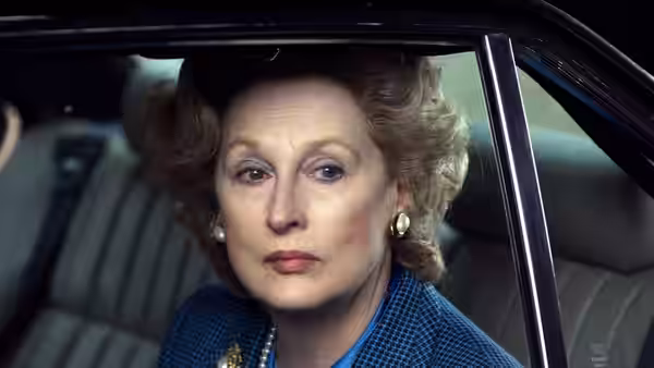 Margaret Thatcher (Meryl Streep) looks out through the window of a car