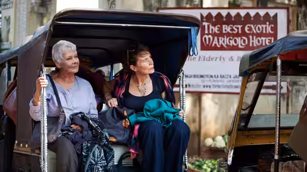 Muriel Donnelly (Maggie Smith) and Evelyn Greenslade (Judi Dench) ride in a tuk-tuk outside the hotel