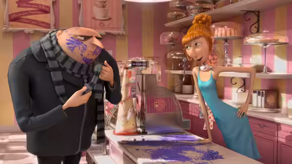 Gru (Steve Carell) wipes purple ink from his face as Lucy (Kristen Wiig) watches in a bakery