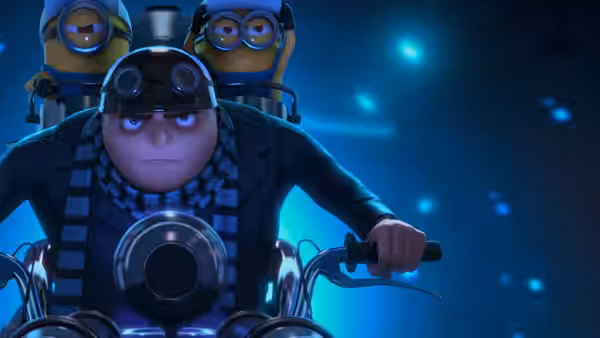 Gru (Steve Carell) rides a motorcycle through a dark blue chamber with Minions clinging behind him