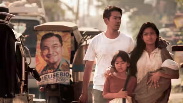 Oscar Ramirez (Jake Macapagal) and Mai Ramirez (Althea Vega) stand with their daughters among Manila's jeepneys