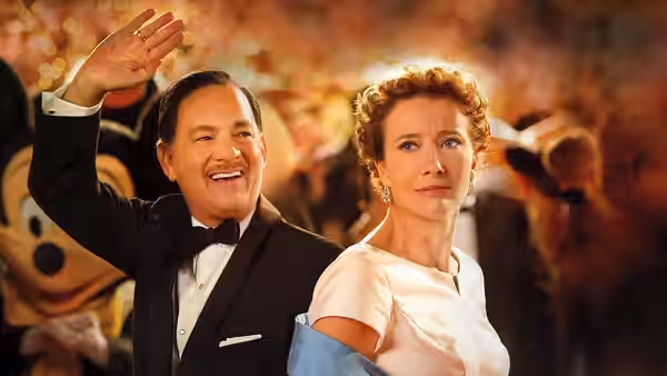 Walt Disney (Tom Hanks) waves beside P.L. Travers (Emma Thompson) at a crowded event