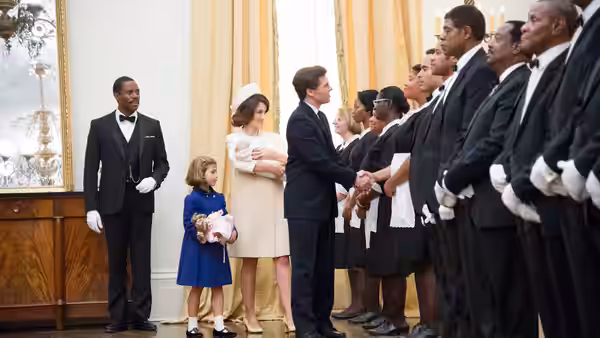 Cecil Gaines (Forest Whitaker) watches as President Kennedy greets White House staff