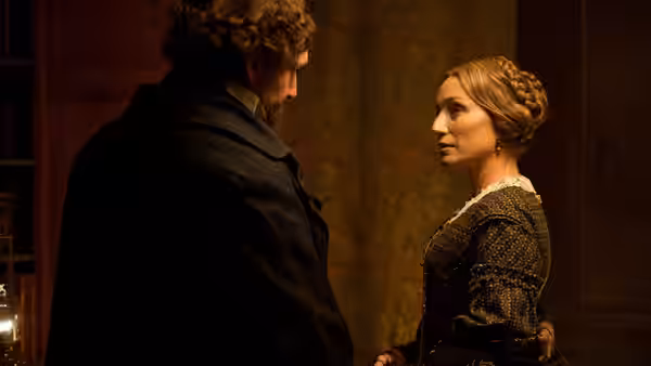 Charles Dickens (Ralph Fiennes) faces Nelly Ternan (Felicity Jones) in a dimly lit room