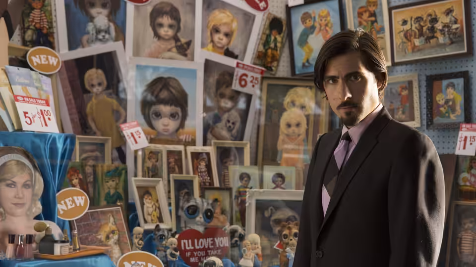 Ruben (Jason Schwartzman) stands among Big Eyes paintings and artwork in a gallery