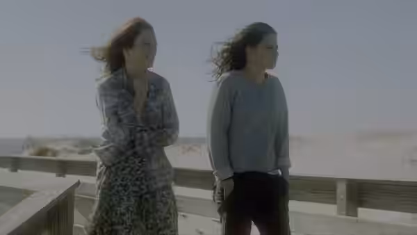 Alice Howland (Julianne Moore) and Lydia Howland (Kristen Stewart) walk beside a beach railing