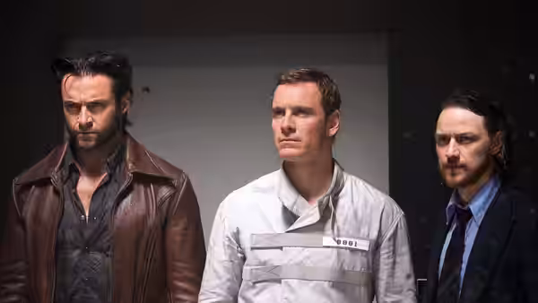 Logan (Hugh Jackman) and Charles Xavier (James McAvoy) flank a man in a white uniform