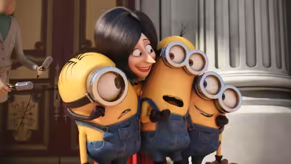 Scarlet Overkill (Sandra Bullock) smiles as three Minions crowd around her indoors