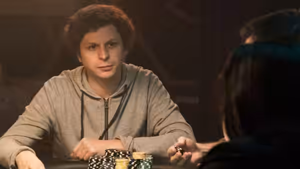 Michael Cera as Player X sits at a poker table with chips