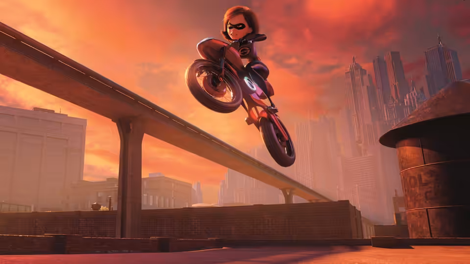 Elastigirl (Holly Hunter) rides a motorcycle above an elevated roadway at sunset