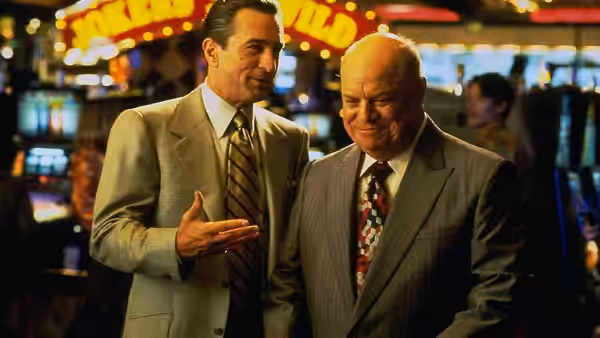Sam 'Ace' Rothstein (Robert De Niro) speaking with an older man in a casino