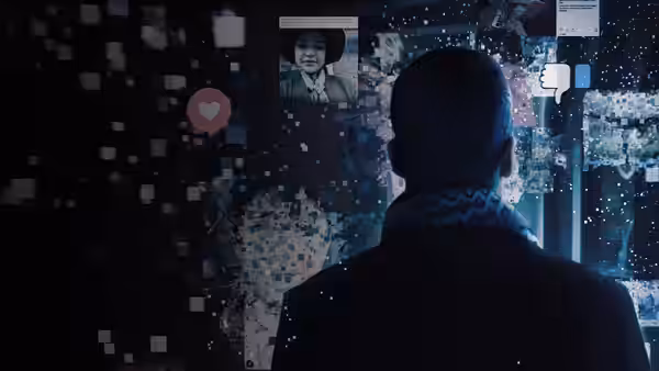 A man studies a wall of social media posts and reactions
