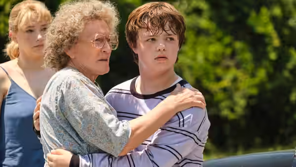 Mamaw (Glenn Close) embraces young J.D. (Owen Asztalos) outdoors