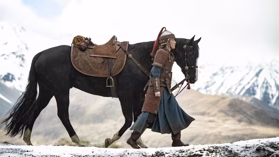 Hua Mulan (Liu Yifei) leads her horse across a snowy mountain path