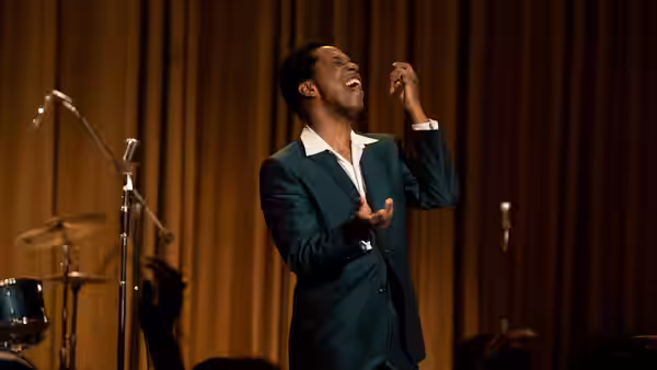 Sam Cooke (Leslie Odom Jr.) sings onstage beside a microphone and drum kit