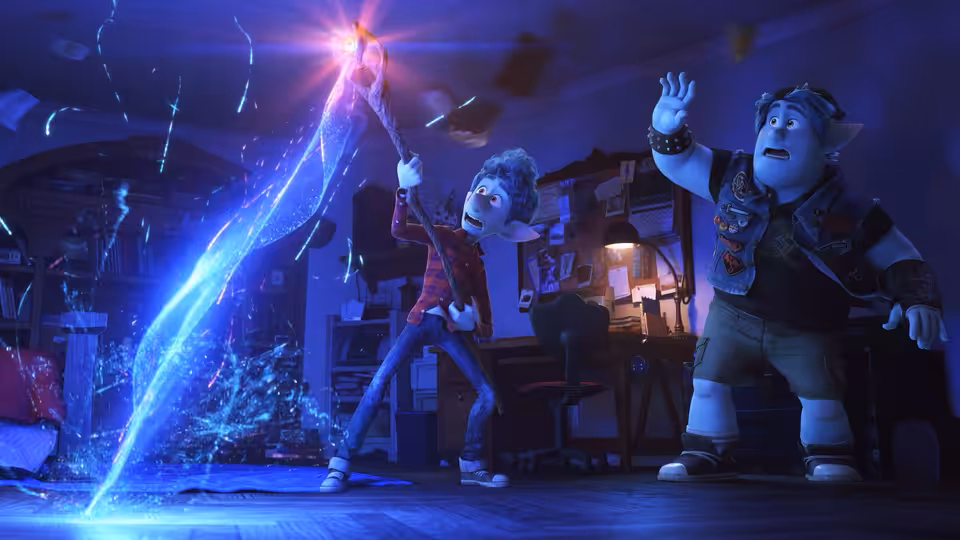 Ian Lightfoot (Tom Holland) raises a glowing staff as Barley Lightfoot (Chris Pratt) watches in a workshop