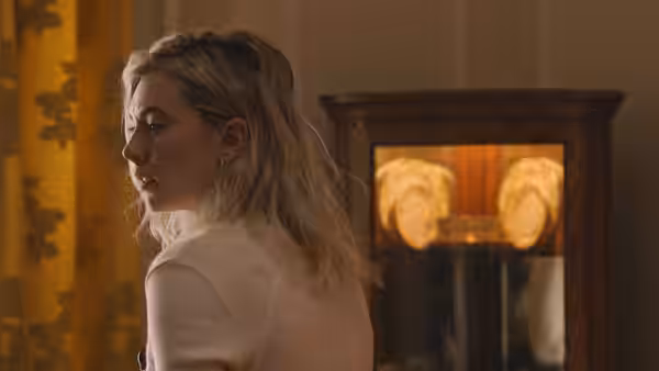 Martha Weiss (Vanessa Kirby) looks back over her shoulder in a warmly lit room