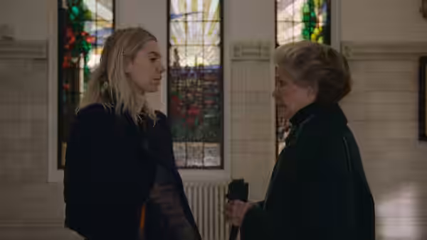 Martha Weiss (Vanessa Kirby) speaks with Elizabeth Weiss (Ellen Burstyn) inside a church with stained-glass windows