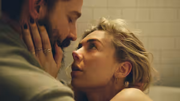 Sean Carson (Shia LaBeouf) holds Martha Weiss (Vanessa Kirby) close as she looks up at him during labor