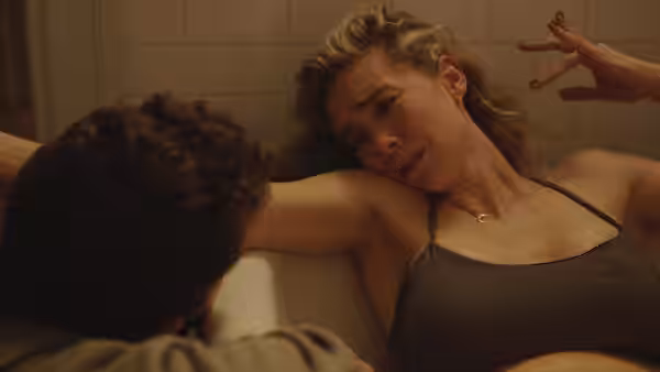Martha Weiss (Vanessa Kirby) leans back in a bathtub as Sean Carson (Shia LaBeouf) supports her during labor