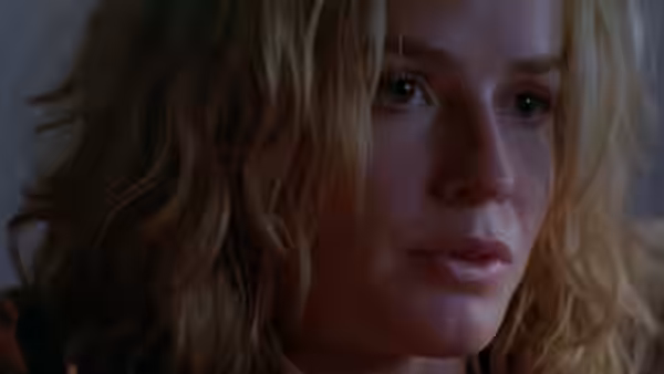 Sera (Elisabeth Shue) with wet face looking to one side