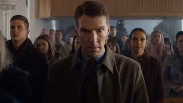 Lt. Stuart Couch (Benedict Cumberbatch) stands among a congregation gathered inside a church