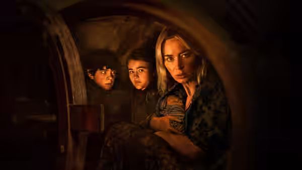 Evelyn Abbott (Emily Blunt) shelters with Regan Abbott (Millicent Simmonds) and Marcus Abbott (Noah Jupe) in a dark compartment