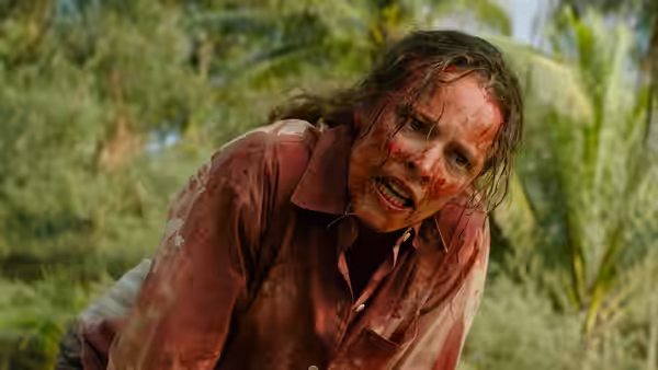 Linda Liddle (Rachel McAdams) bloodied and distressed among green jungle foliage