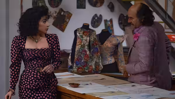 Patrizia Reggiani (Lady Gaga) speaks with Paolo Gucci (Jared Leto) in a fashion design studio