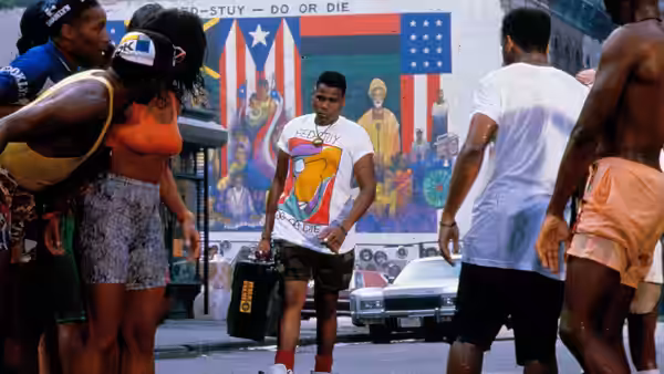 Radio Raheem (Bill Nunn) stands in the street with his boombox at his feet