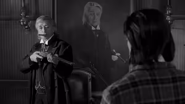John Dickinson (Robert Mitchum) holds a rifle facing William Blake in an office