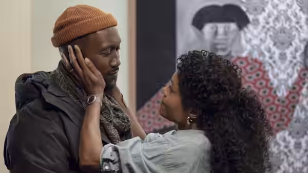 Poppy Turner (Naomie Harris) cups Cameron's face as they stand close together