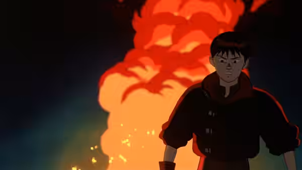 Kaneda standing before a huge orange explosion at night
