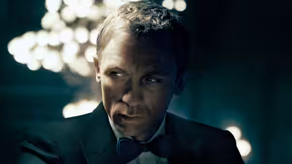 James Bond (Daniel Craig) with a focused intense gaze in formal attire