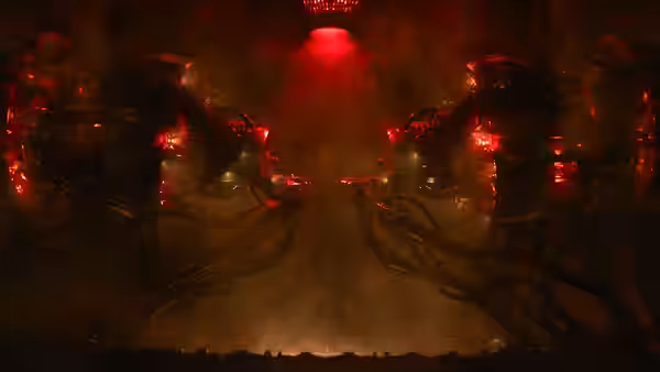Two humanoid heads sit enclosed in mechanical apparatus beneath red lights