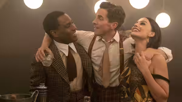 Harold Woodman (John David Washington), Burt Berendsen (Christian Bale), and Valerie Voze (Margot Robbie) celebrate arm in arm