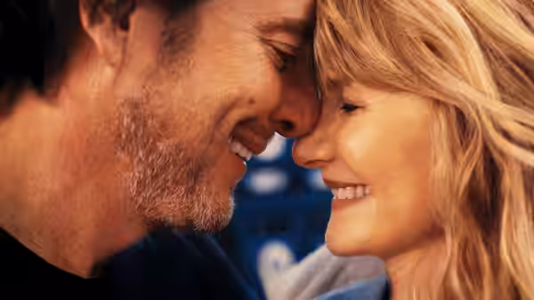 Alex Novak (Will Arnett) and Tess Novak (Laura Dern) touching foreheads and smiling